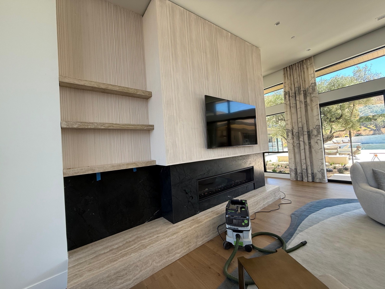 Custom fireplace wall with built-in shelving